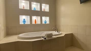 Room, 1 King Bed, Jetted Tub | Bathroom | Free toiletries, hair dryer, towels, soap