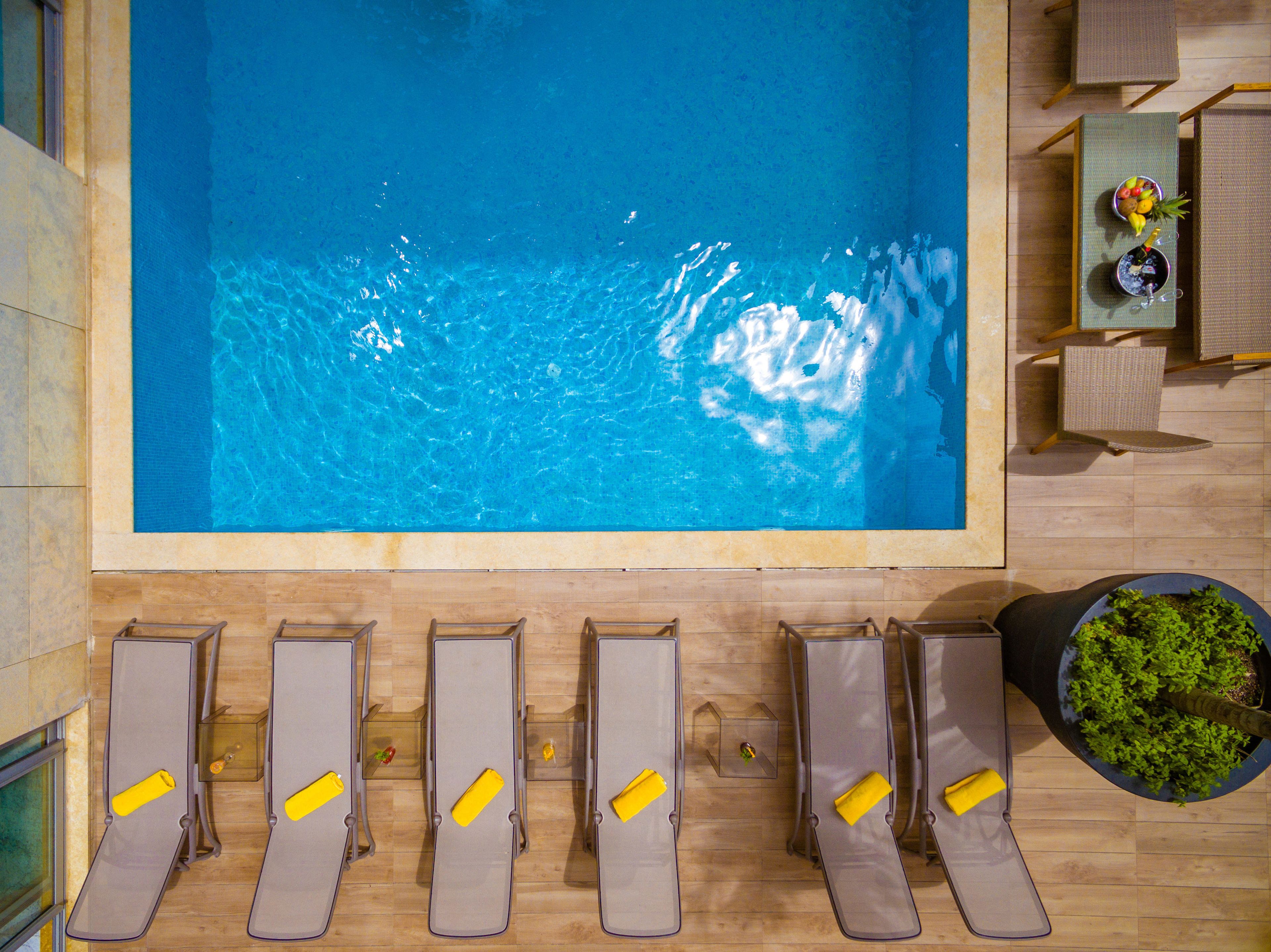 outdoor pool, pool umbrellas, pool loungers