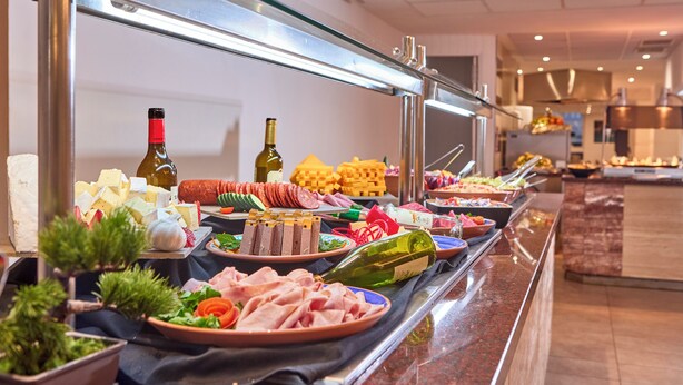 A buffet with various food items including meats, cheeses, and vegetables. - Hotel Ilusion Calma & Spa (Palma de Mallorca)