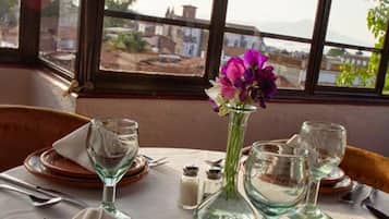 Breakfast, lunch, dinner served; local cuisine, alfresco dining