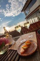 Breakfast, lunch, dinner served; local cuisine, alfresco dining 