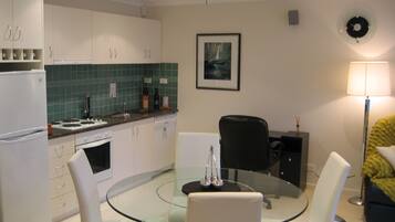 Premier Apartment, Non Smoking, Kitchen (INTEGRITY PREMIER SPA) | Living area | LCD TV, DVD player