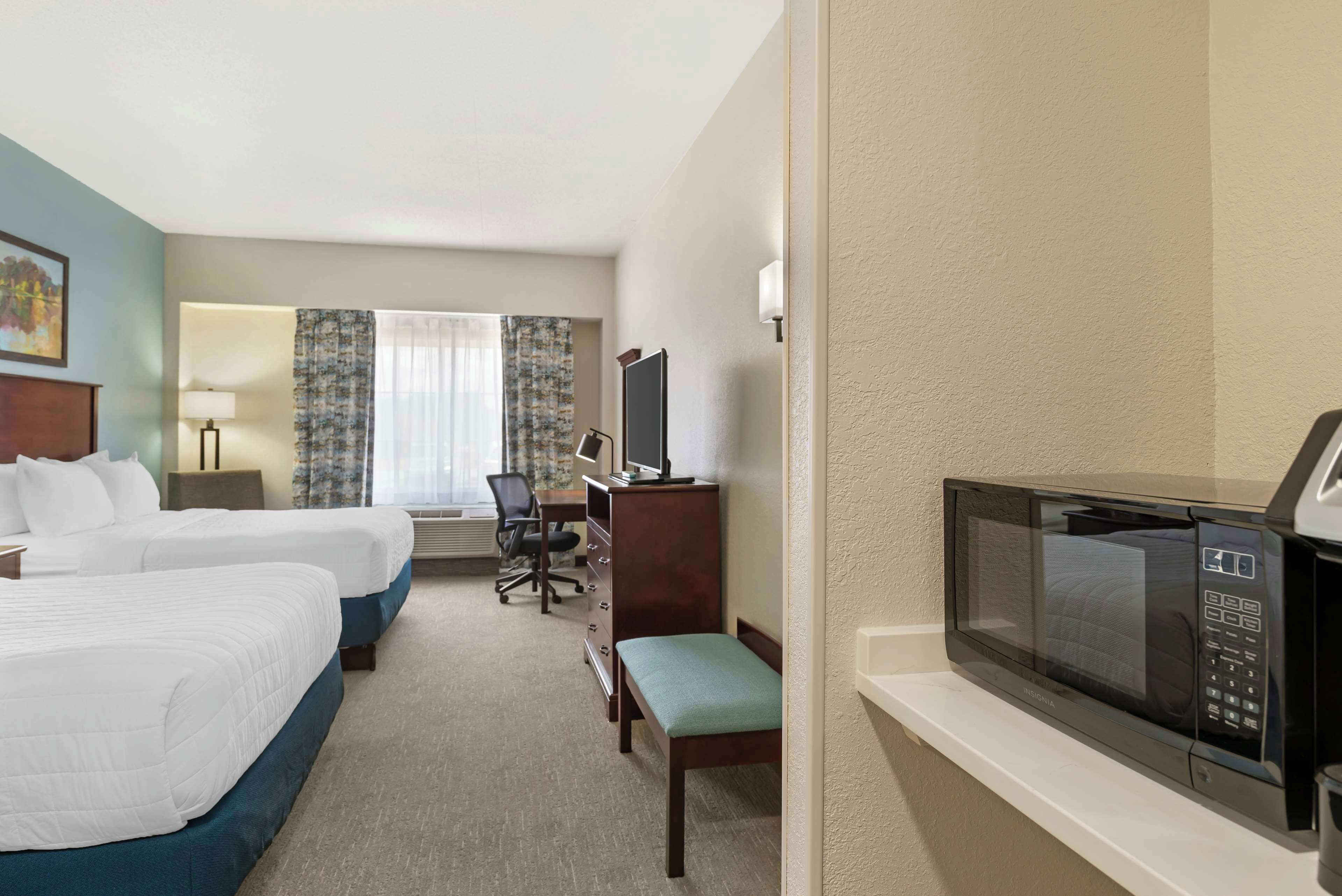 standard room, 2 queen beds, non smoking, refrigerator & microwave | in-room safe, desk, laptop workspace, iron/ironing board