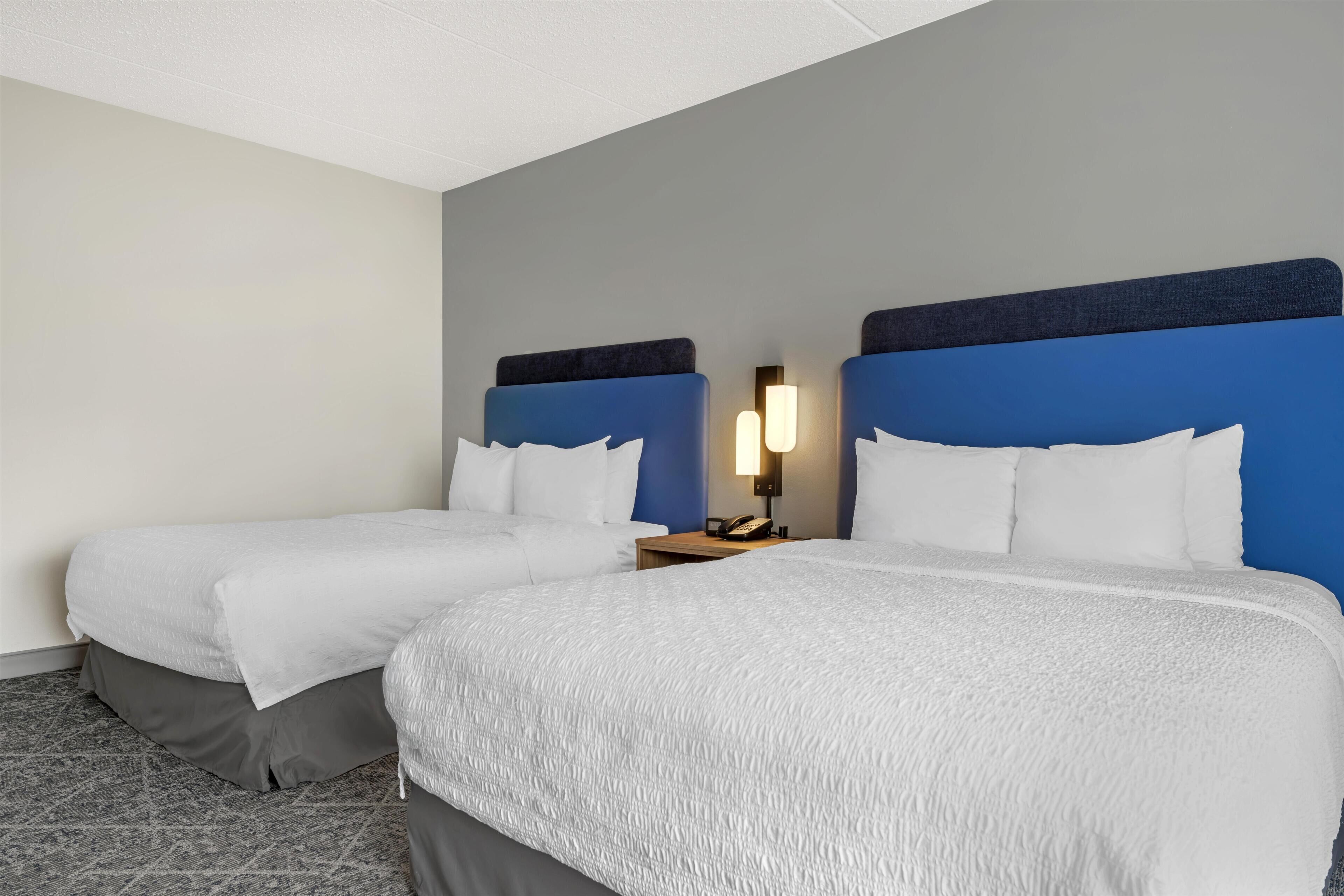Premium bedding, down comforters, pillowtop beds, laptop workspace