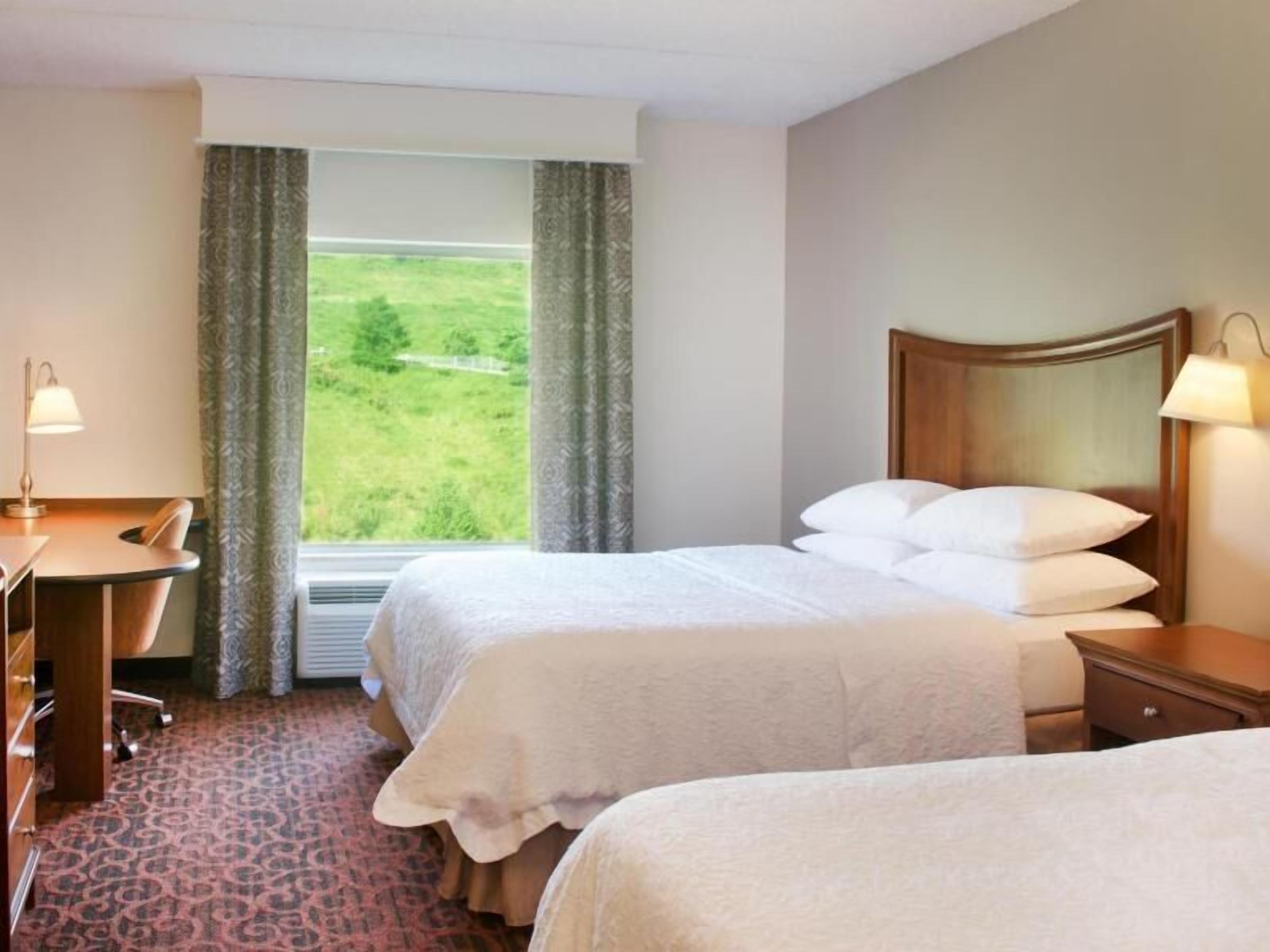 Premium bedding, down comforters, pillowtop beds, laptop workspace