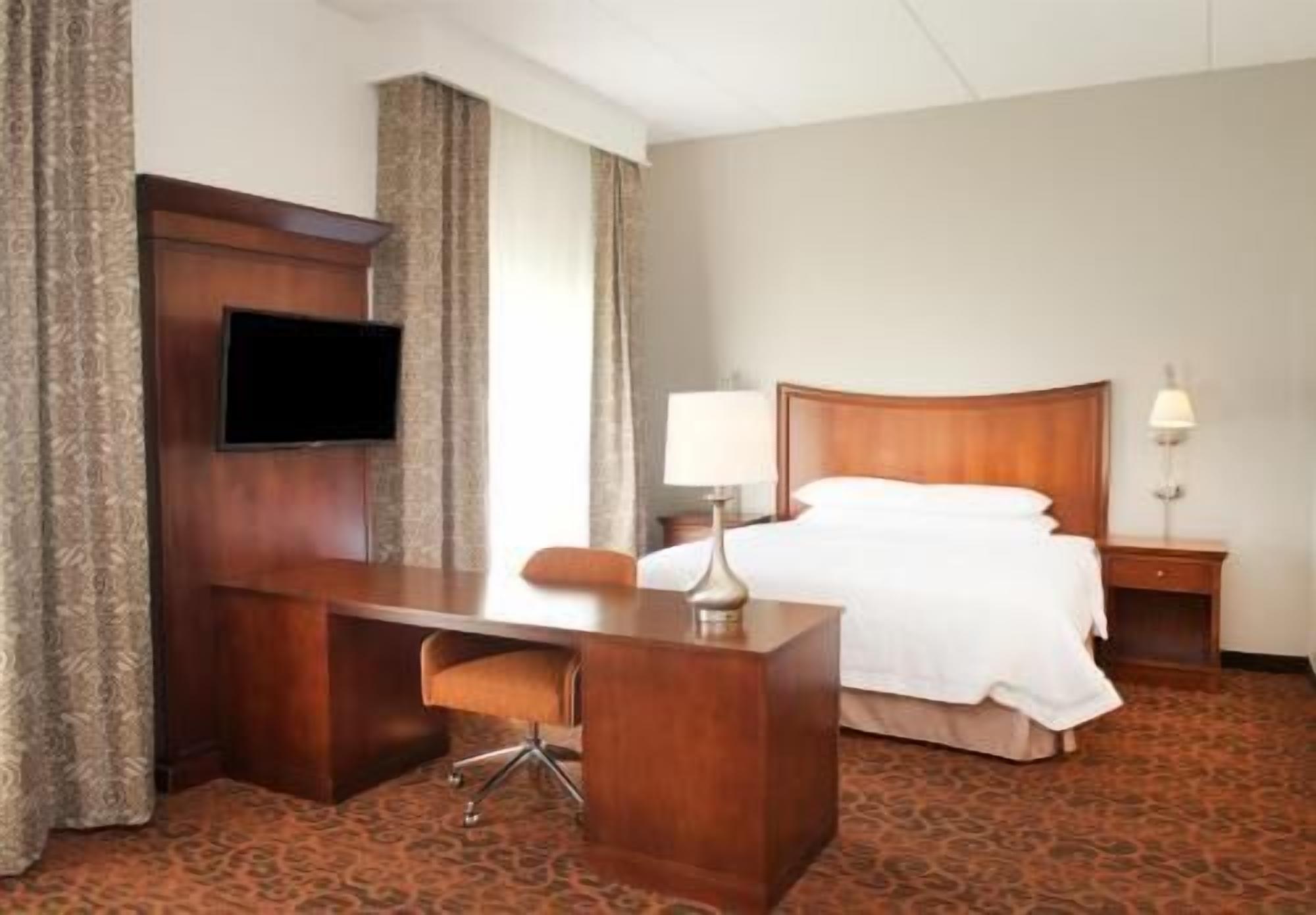 Premium bedding, down comforters, pillowtop beds, laptop workspace