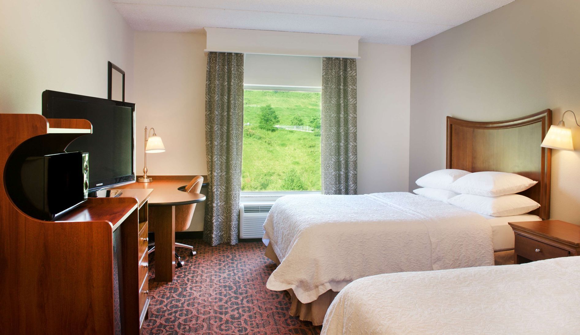 Premium bedding, down comforters, pillowtop beds, laptop workspace