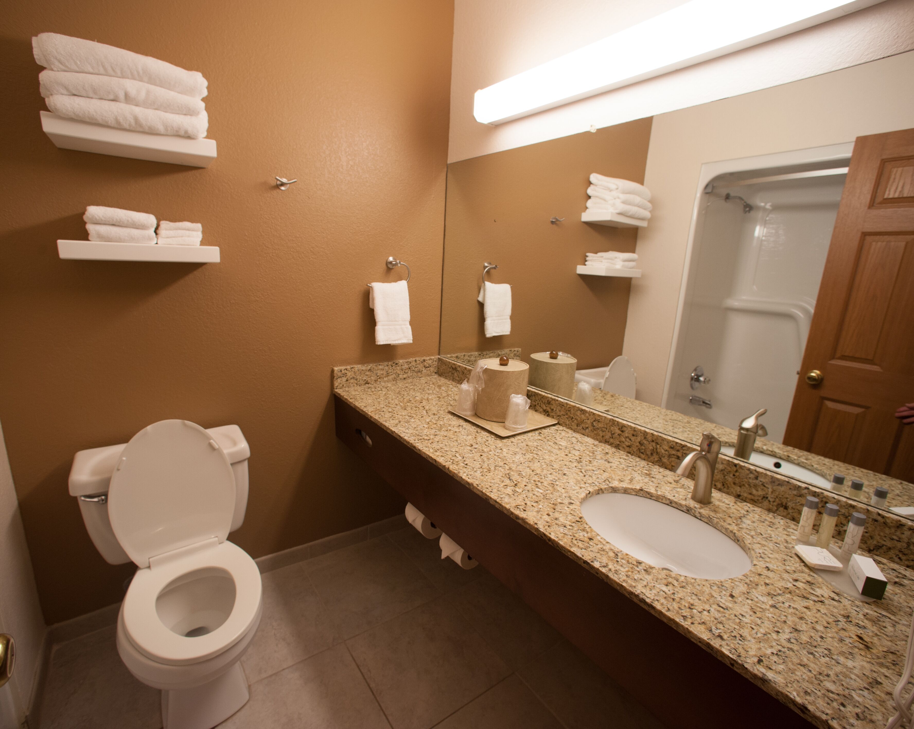 deluxe single room | bathroom | designer toiletries, hair dryer, towels