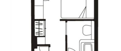 A floor plan of a hotel room with a bed, a desk, a chair, a bathroom, and a small sitting area.