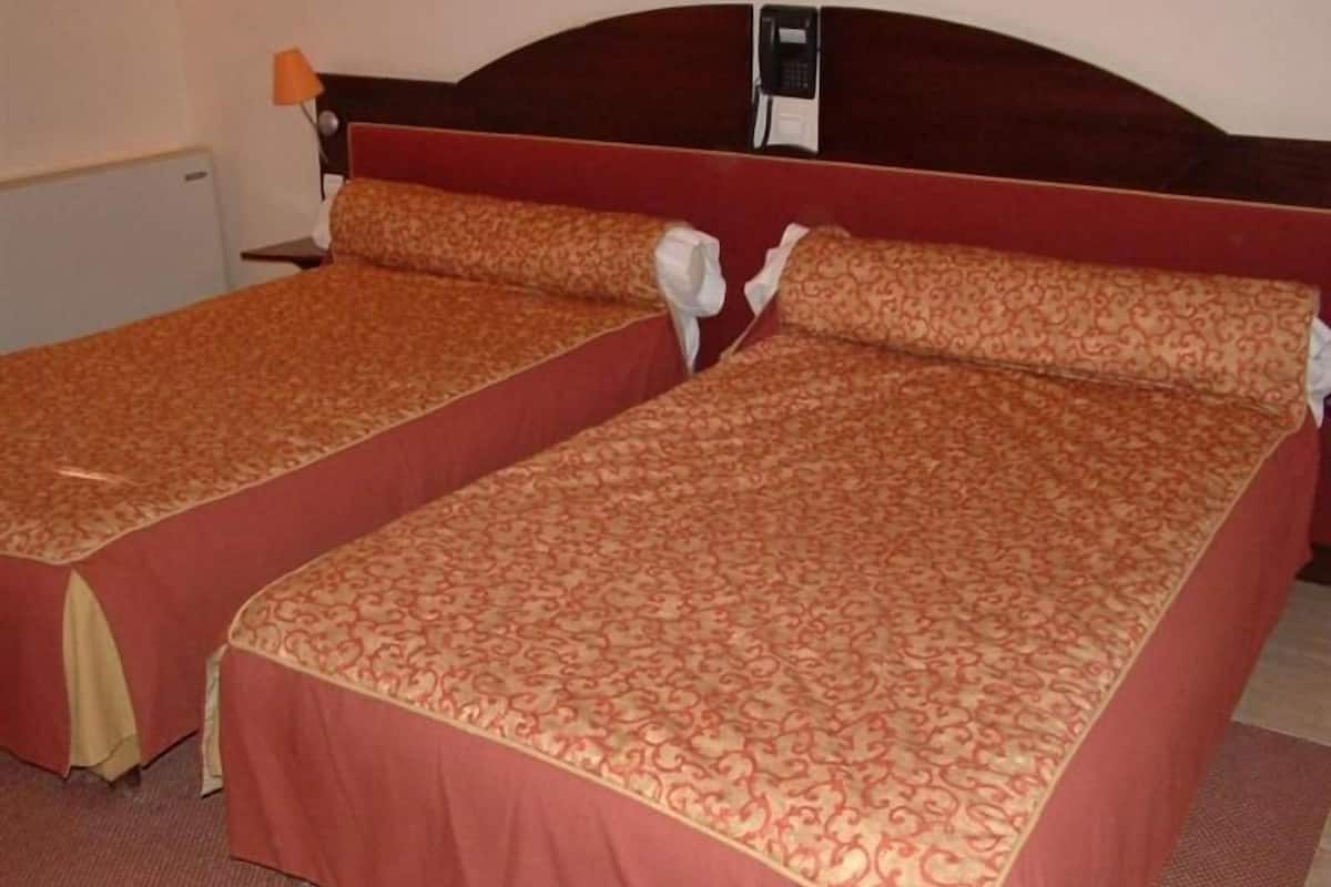 Standard Room | 1 bedroom, premium bedding, minibar, in-room safe