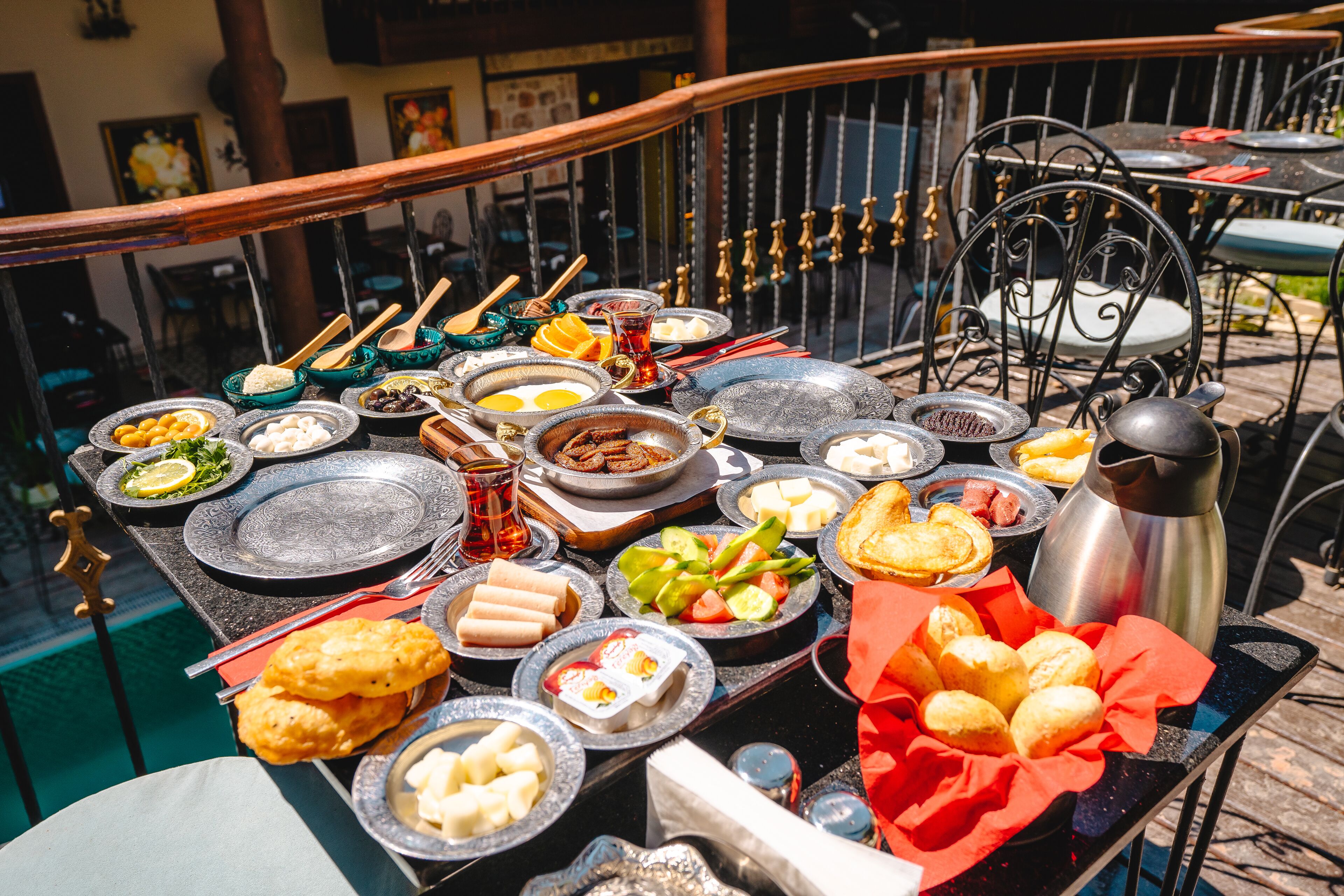A table set with various dishes and utensils, likely for a meal.