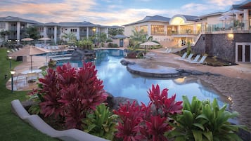 Relax by the pool surrounded by lush landscaping and enjoy lounge chairs and umbrellas.