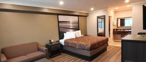 Room, 1 King Bed, Non Smoking | Pillowtop beds, in-room safe, blackout drapes, iron/ironing board