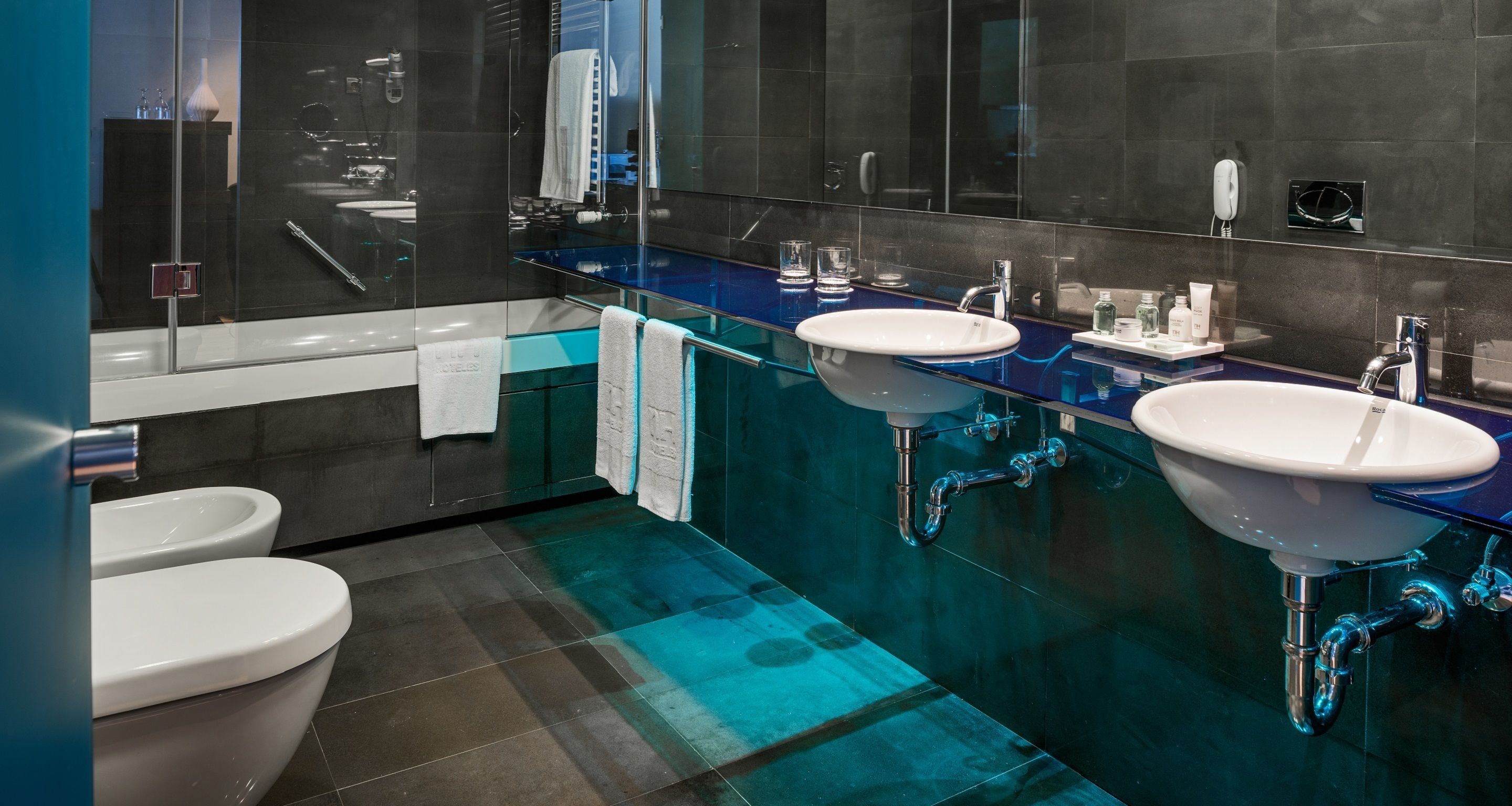 eco-friendly toiletries, hair dryer, towels