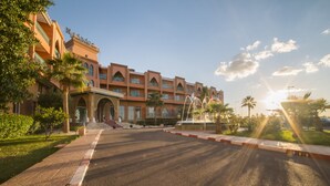 A hotel with a traditional architectural style, featuring multiple balconies and a central courtyard with a fountain. - Mogador Kasbah (Marrakech)