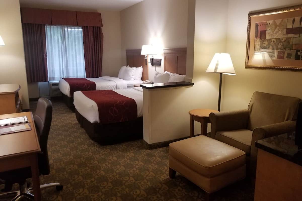Premium bedding, desk, laptop workspace, blackout drapes