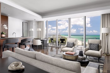 A massage therapy session in a room with a view of a body of water. at The Ritz-Carlton Bal Harbour, Miami