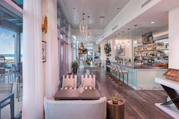 On the beach, white sand, sun loungers, beach umbrellas at The Ritz-Carlton Bal Harbour, Miami