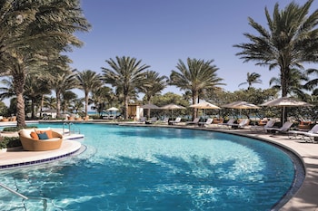 Outdoor pool, cabanas (surcharge), pool umbrellas at The Ritz-Carlton Bal Harbour, Miami