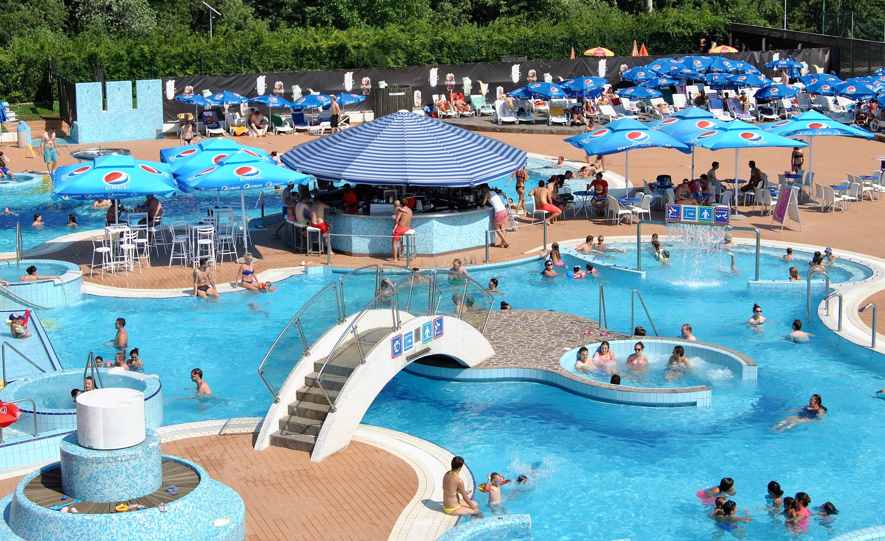 Seasonal outdoor pool, pool umbrellas, pool loungers