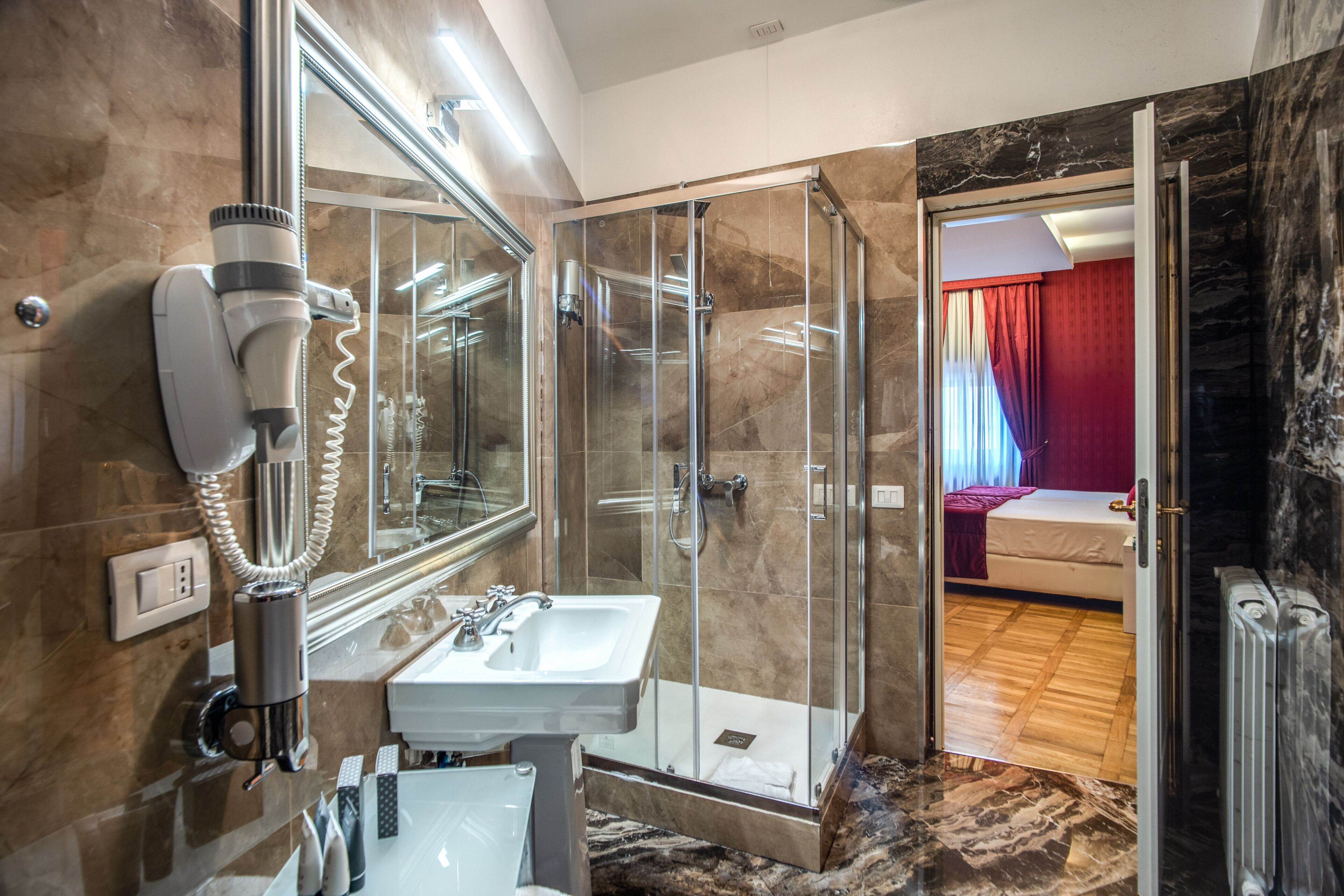 junior suite | bathroom | shower, rainfall showerhead, free toiletries, hair dryer