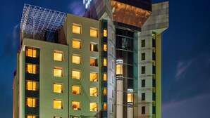 A multi-story hotel with a prominent sign reading "TUNGA" and "THE REGENZA by FUNCA". - The Regenza by Tunga (Navi Mumbai)