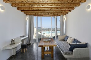 Cave Suite outdoor private pool, Caldera View | Living area | Flat-screen TV