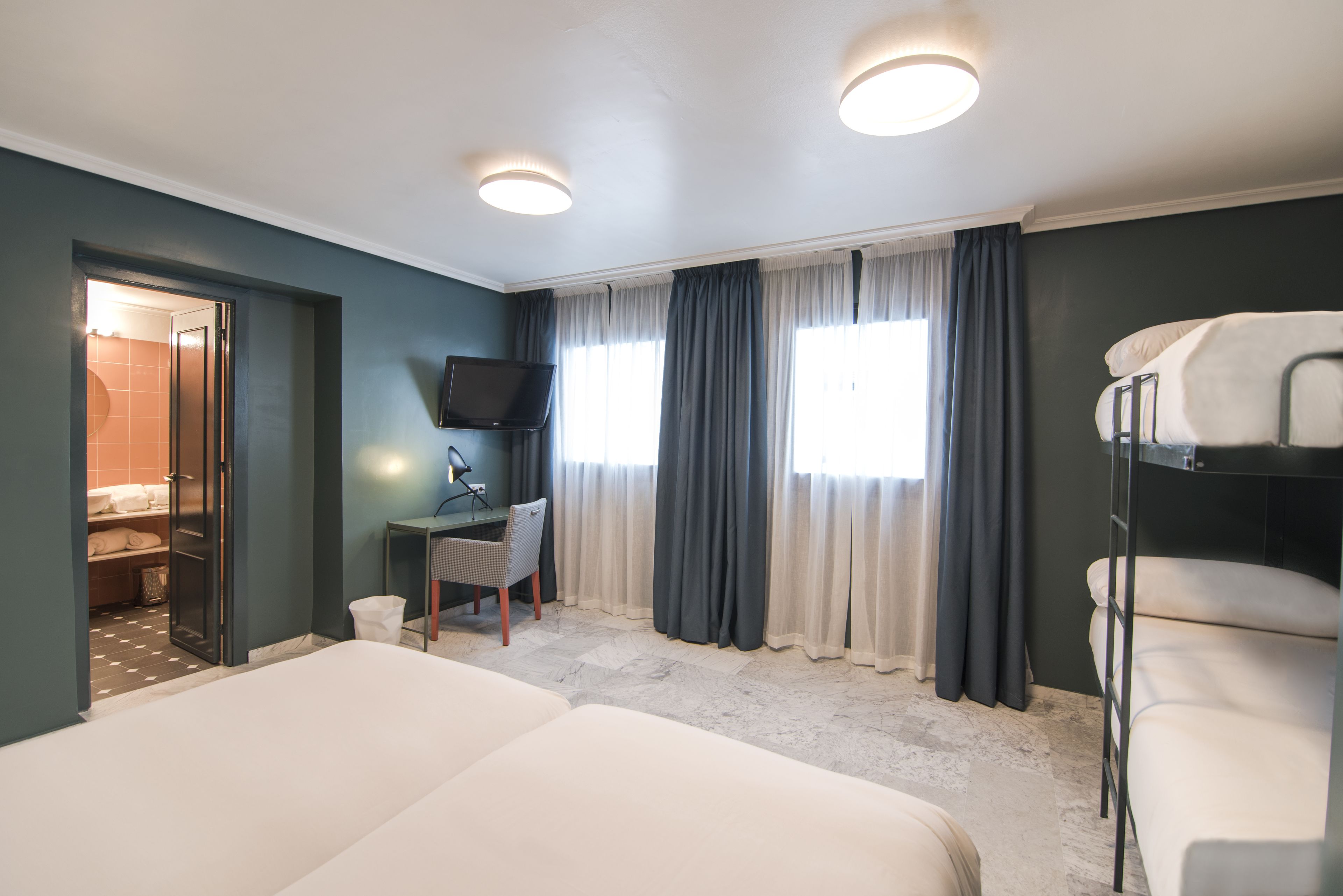 quadruple room | 1 bedroom, in-room safe, desk, blackout curtains