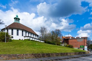 Experience the blend of historic charm and modern style at the Sachsenwald Park Hotel, set amidst a unique architectural landscape.