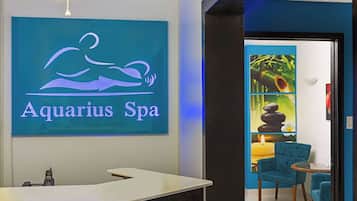 Relax in style at Aquarius Spa, featuring a reception desk, seating area, and serene ambiance.