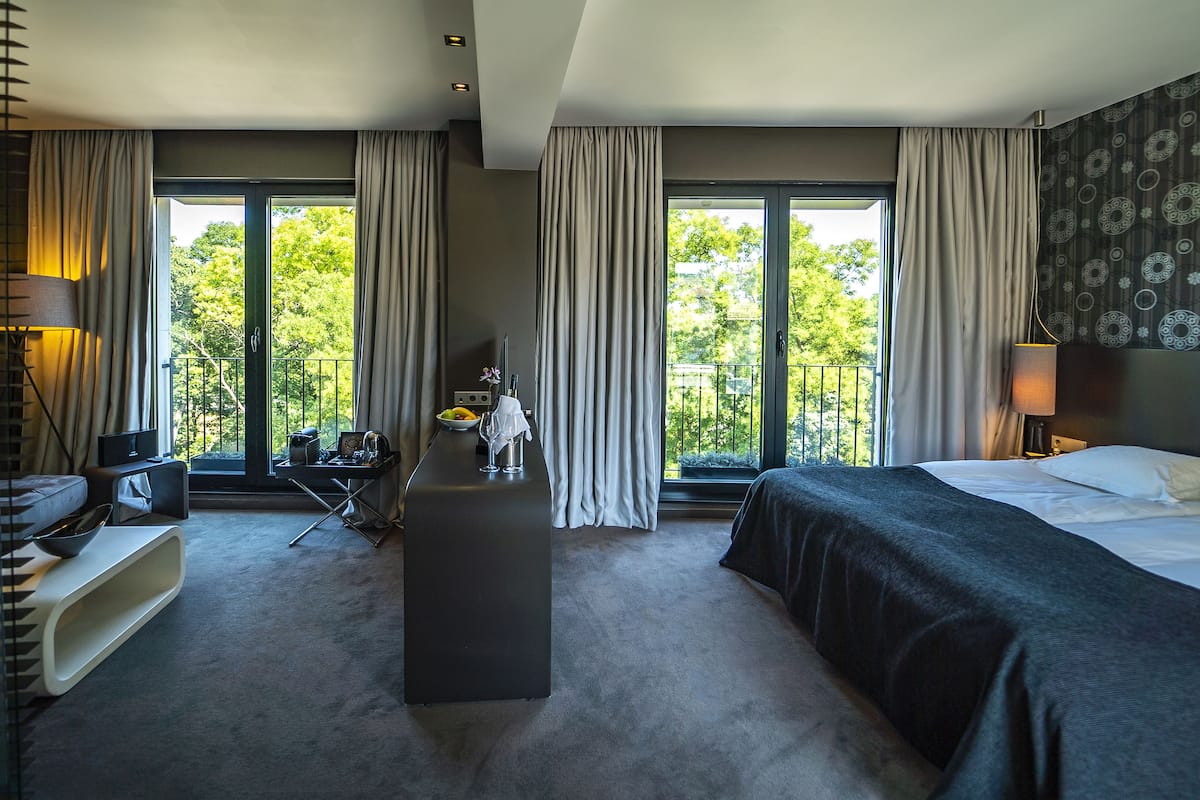 Medium Suite (Free Safe, Free Fitness & Sauna) | Down comforters, minibar, in-room safe, individually decorated