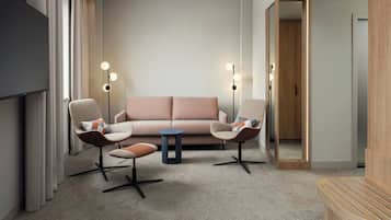 A modern living room with a sofa, two armchairs, a coffee table, and a TV. There are two floor lamps and a mirror on the wall.