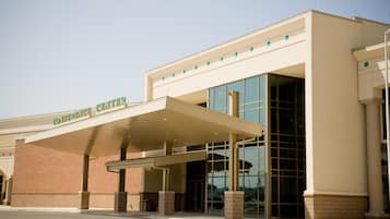 A building with a covered entrance and large windows.
