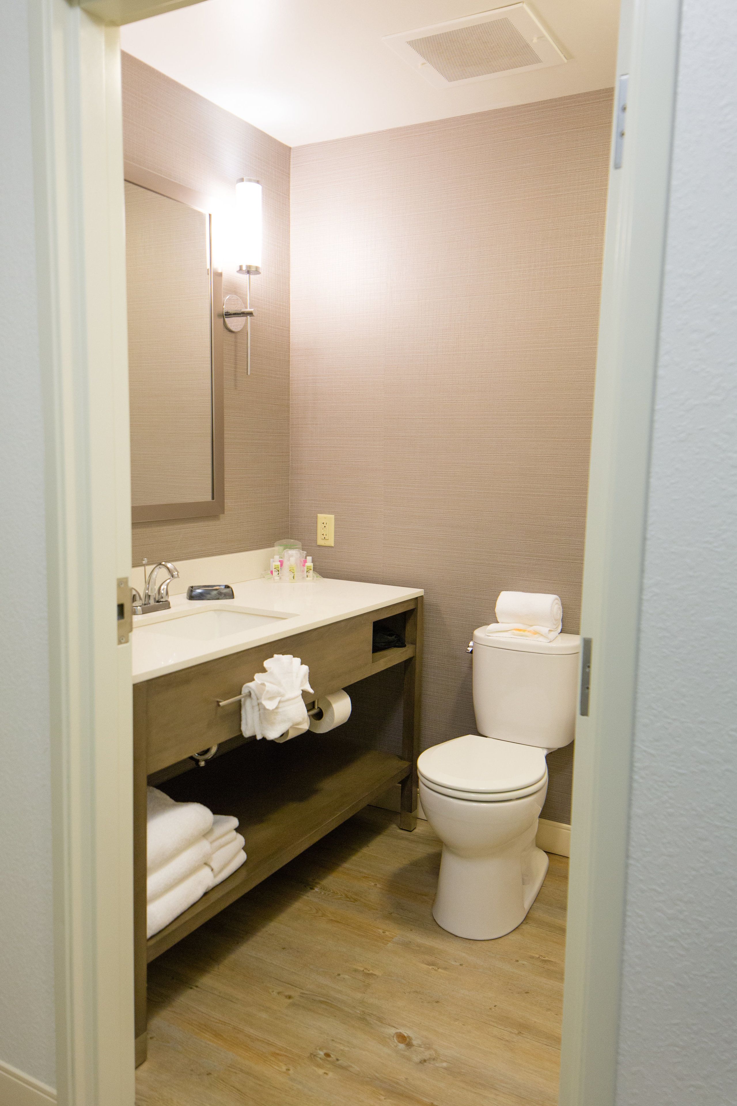 combined shower/bathtub, designer toiletries, hair dryer, towels