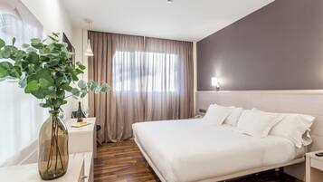 Luxe beddengoed, een minibar, een kluis op de kamer, een bureau