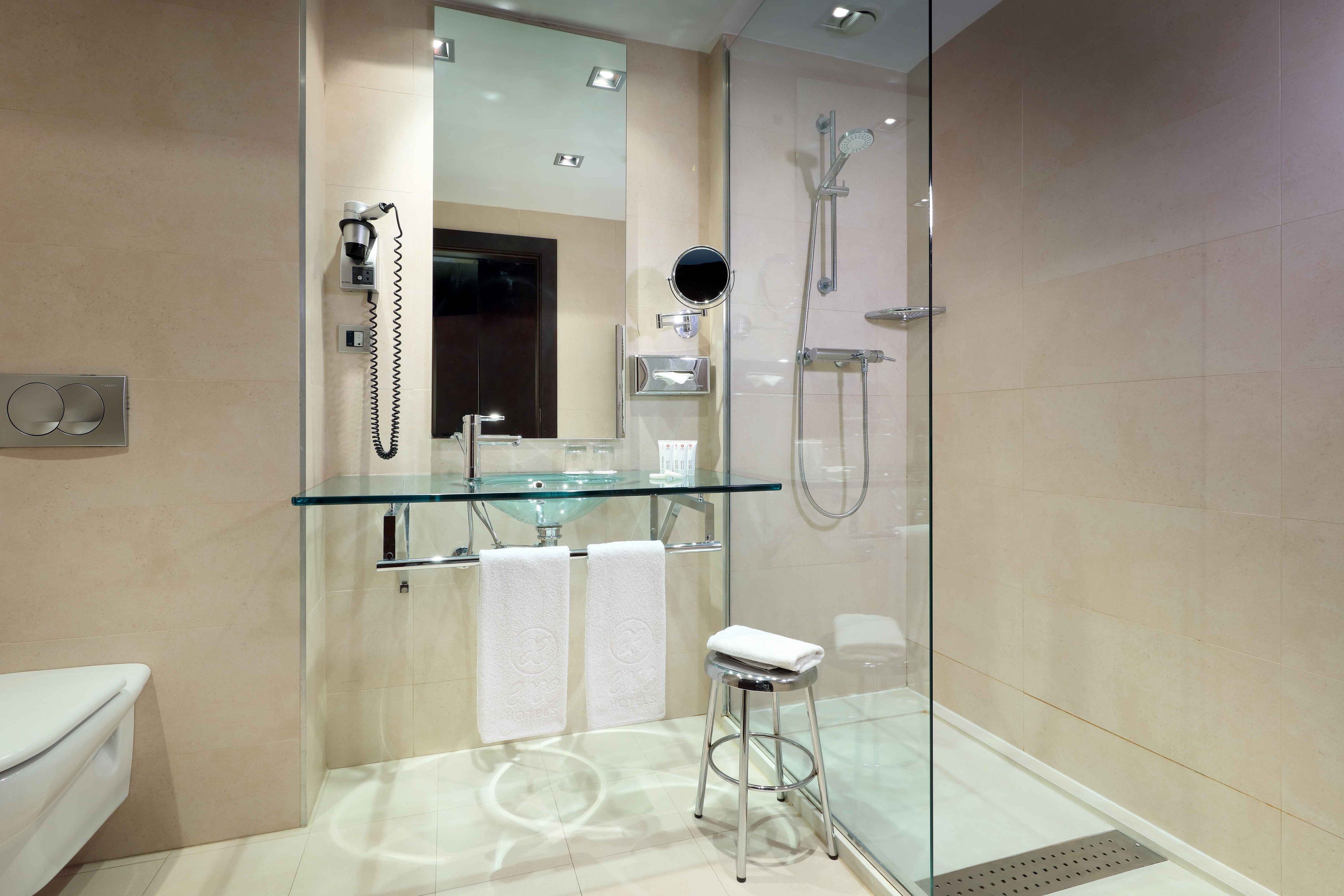 shower, eco-friendly toiletries, hair dryer, towels