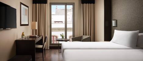 Memory-foam beds, minibar, in-room safe, desk