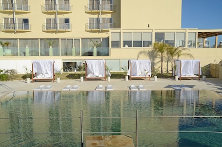 Outdoor pool, open 9:00 AM to 6:00 PM, pool umbrellas, sun loungers. E Hotel Spa & Resort Cyprus