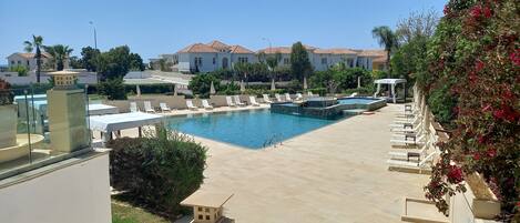 Outdoor pool, open 9:00 AM to 6:00 PM, pool umbrellas, sun loungers