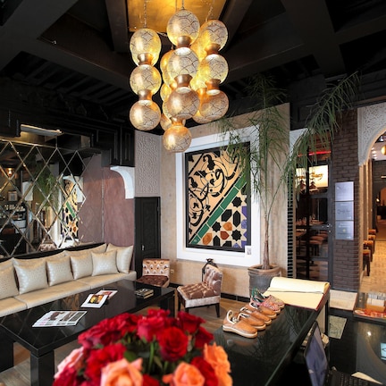 A modern interior with a sofa, coffee table, and decorative lighting.