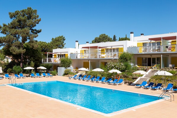 3 outdoor pools, open 9:00 AM to 8:00 PM, pool umbrellas, pool loungers