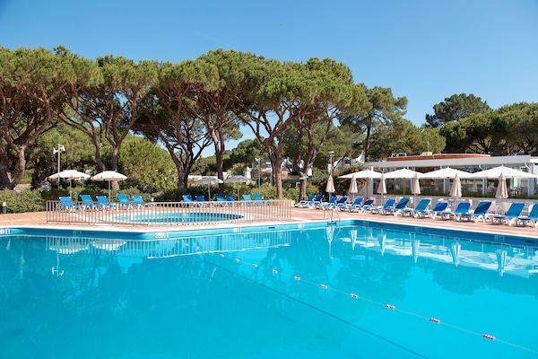 3 outdoor pools, open 9:00 AM to 8:00 PM, pool umbrellas, pool loungers