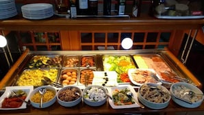 A buffet with various food options including rice, meats, and vegetables. - Hotel Dubrovnik (Dubrovnik)