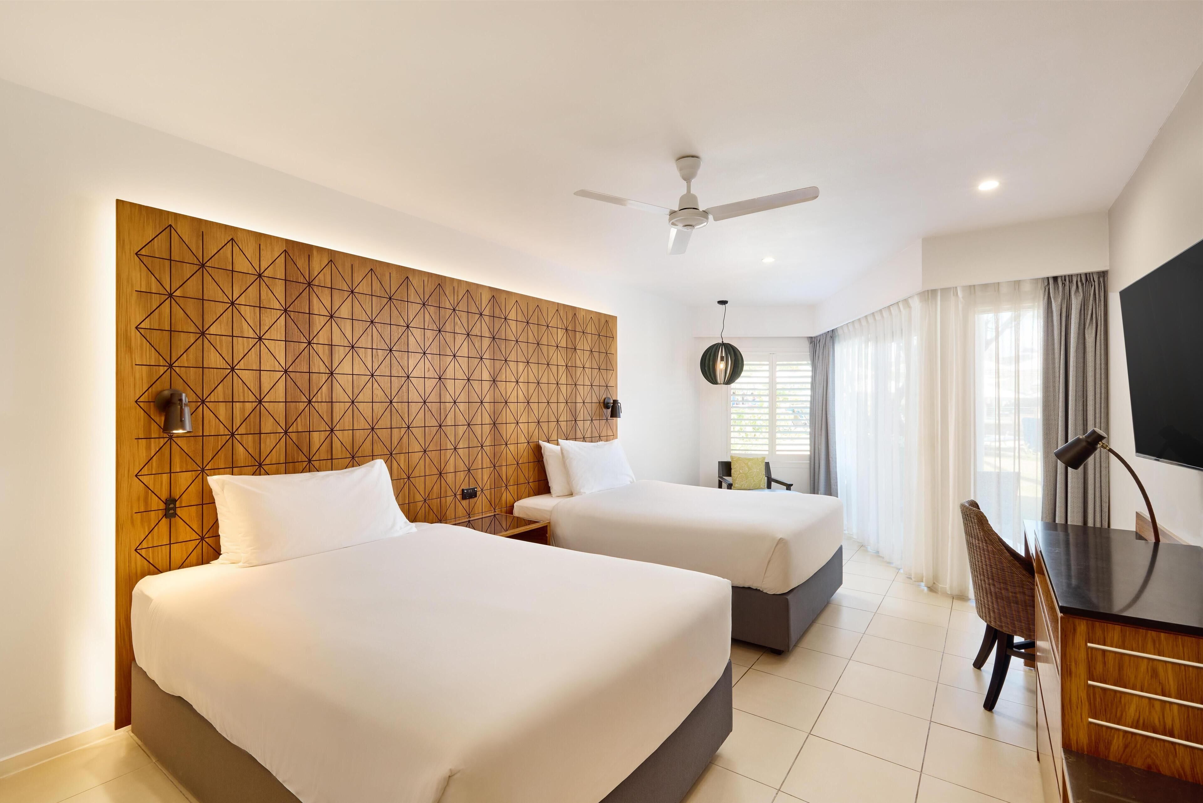 Deluxe Room, Courtyard Area | Premium bedding, minibar, in-room safe, desk