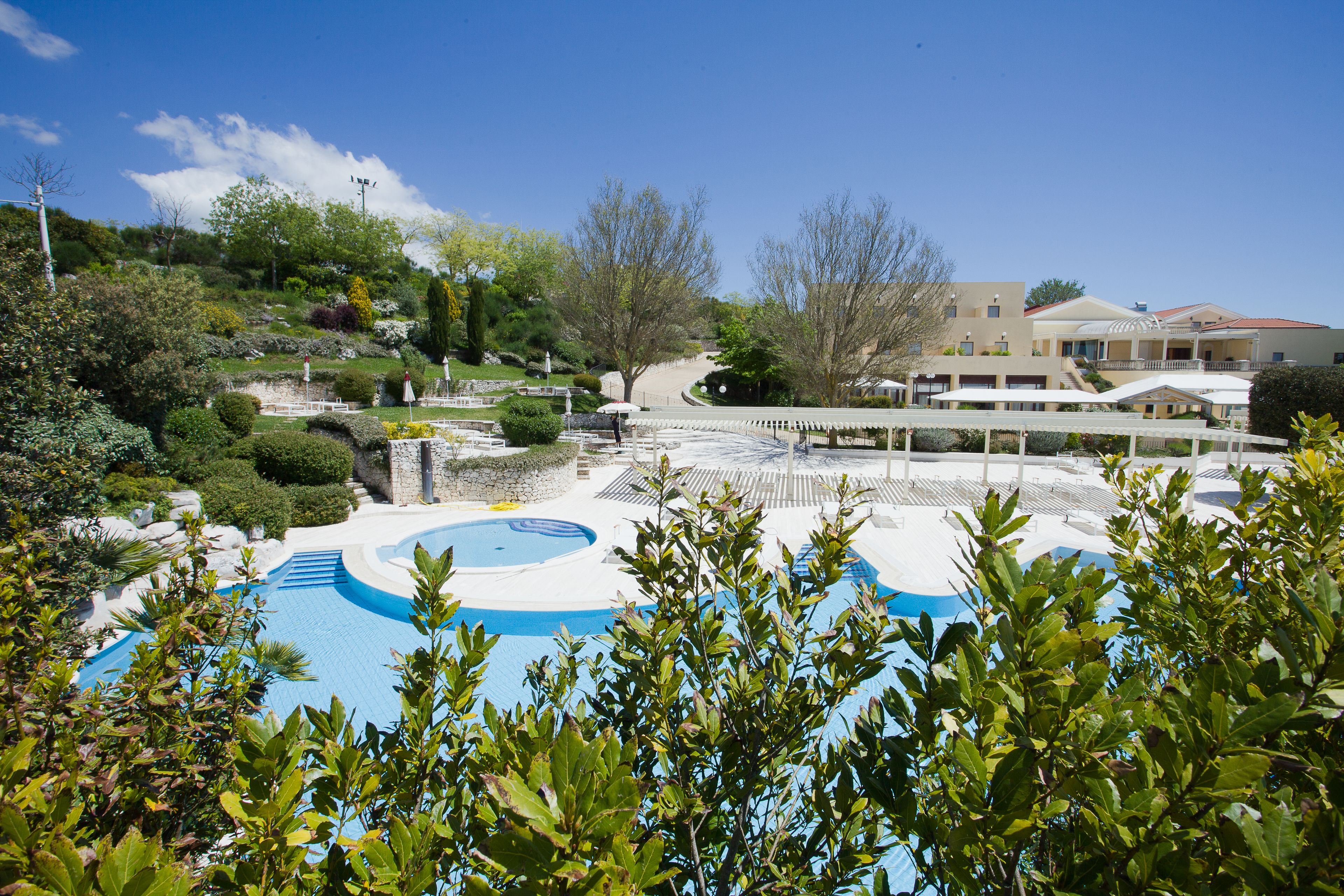 seasonal outdoor pool, open 9 am to 7 pm, pool umbrellas, pool loungers