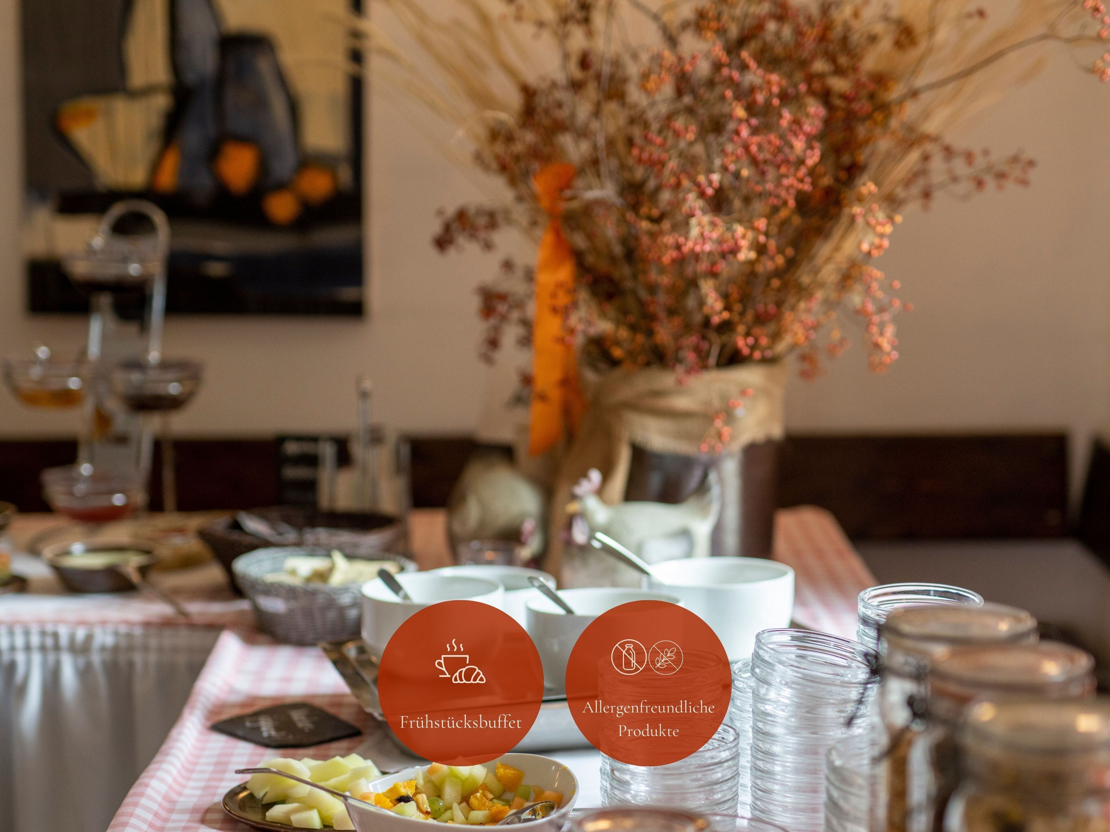 A dining table with a fruit buffet and allergen-friendly products.