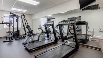 A gym with treadmills, ellipticals, and weight machines.
