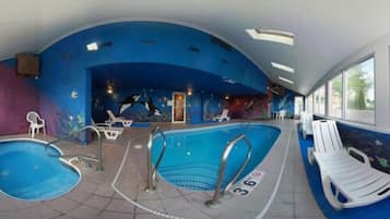 Relax by the pool with lounge chairs and a diving board.
