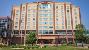 A Hilton Garden Inn hotel with a brick facade, multiple floors, and a covered entrance area. - Hilton Garden Inn Mankato Downtown (Mankato)
