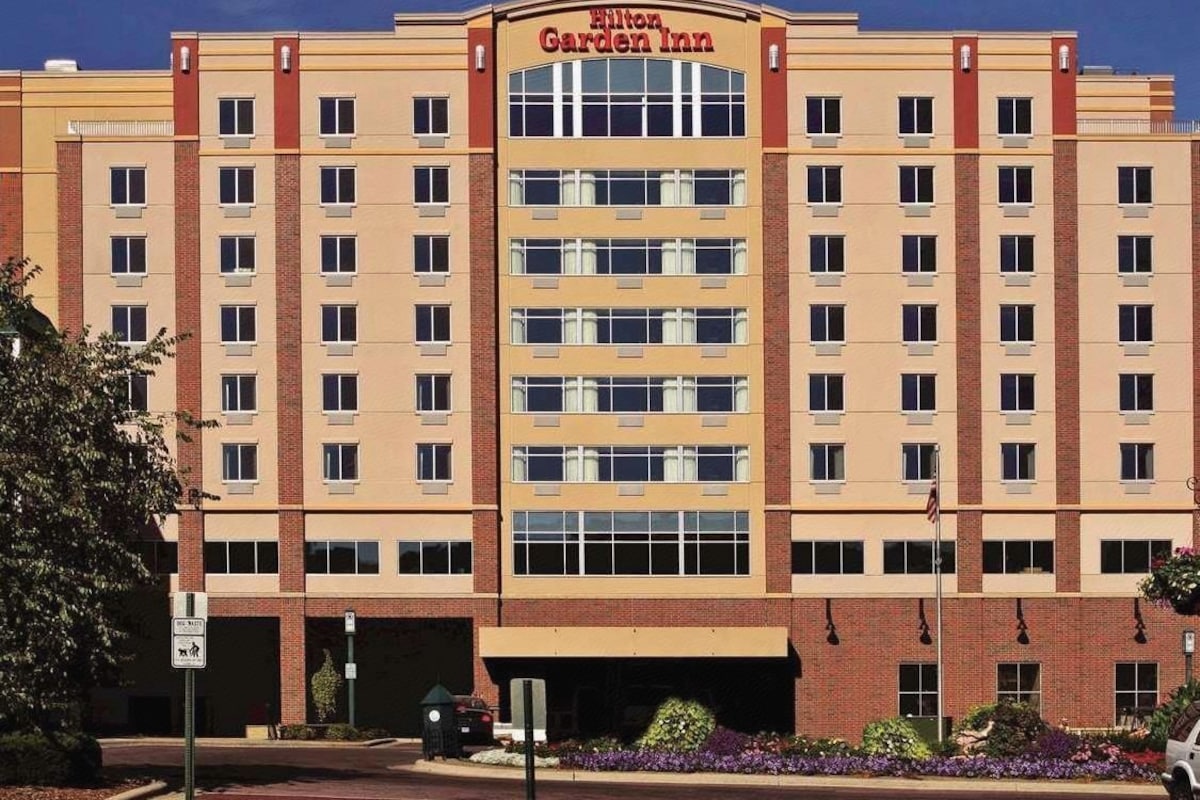 A multi-story Hilton Garden Inn hotel with a prominent entrance and a parking garage.